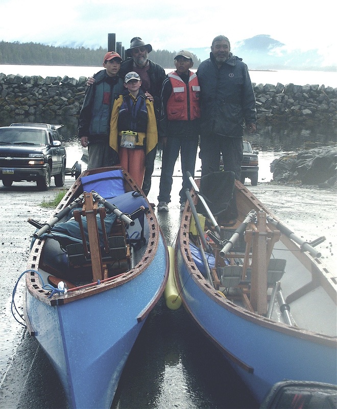 Three Tsimshian boys with dads and rowboats.