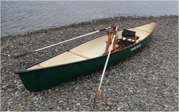Adventurer rowing canoe.